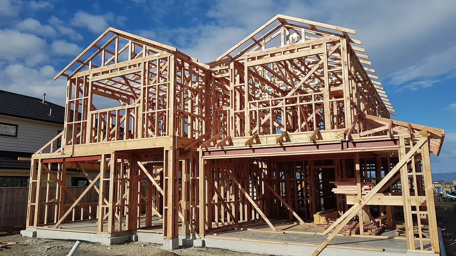 Timber wall and roof framing under construction in New Zealand.