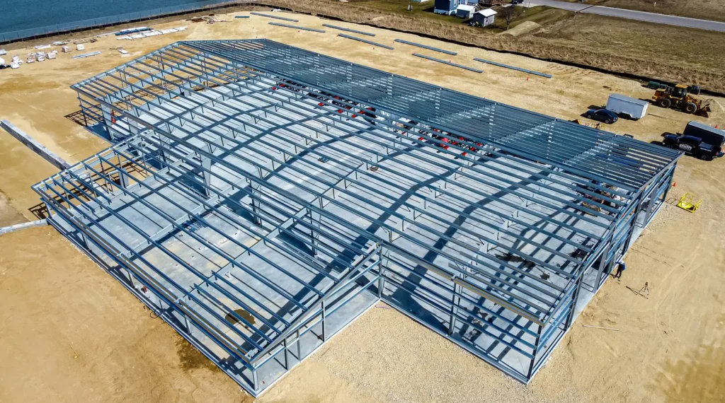 Aerial view of a structural steel frame under construction.