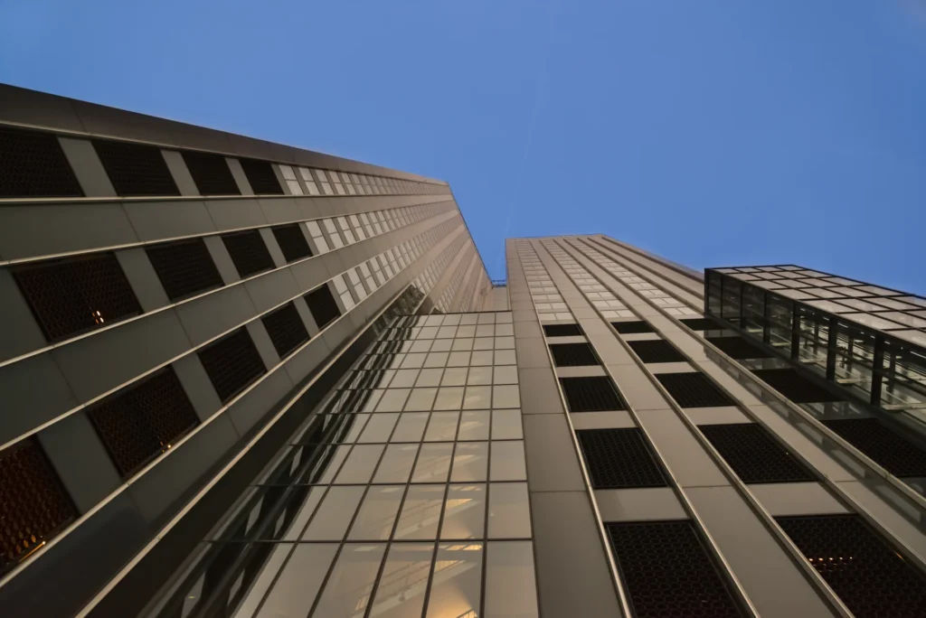 Upward view of angular office towers in Rotterdam.