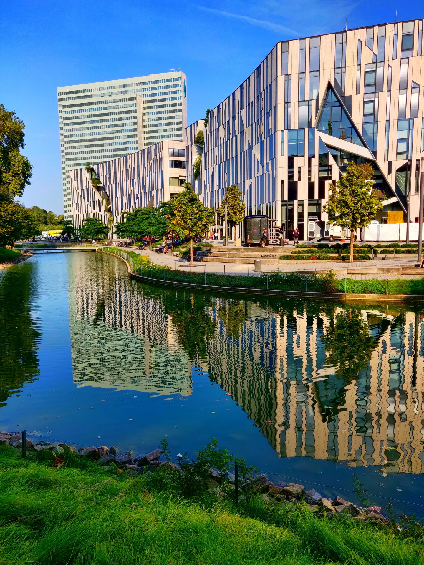 Completed Ko-Bogen offices reflected in water.